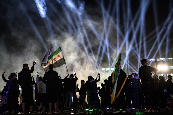 People in Damascus celebrate a year since the downfall of the Assad regime.