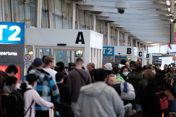 Queues snaking outside Sydney Airport’s domestic Terminal 2 in July. 