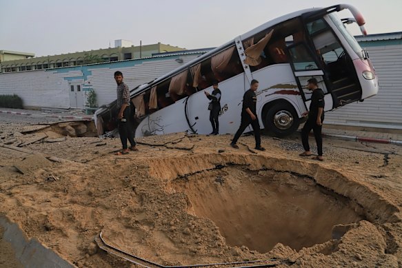 Palestinians inspect the site of an Israeli army airstrike on the European hospital in Khan Younis.