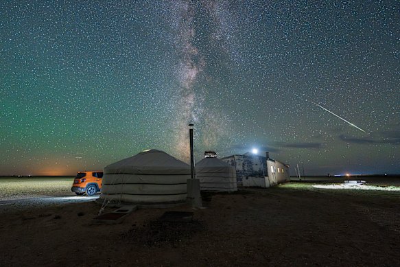 A meteor streaks across the sky above a Mongolian herder’s house in Dahongshan.