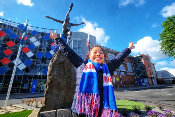 Western Bulldogs supporter Eloiza Soluta celebrates her team making the AFL grand final at Whitten Oval on Sunday. 