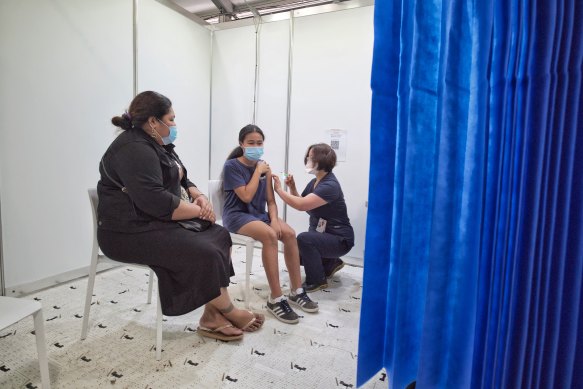 Easter Leau, 12, receives her first Moderna vaccine at the vaccination Hub in Dandenong on Sunday.