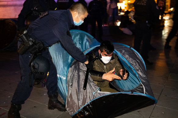 Police removed tents from the Place de la Republique in Paris with migrants still in them.
