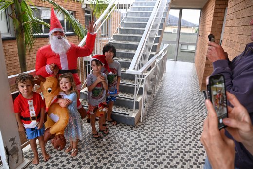 Margie Charlton dressed up as Santa Claus to spread some Christmas cheer to her neighbours on Sydney's northern beaches.