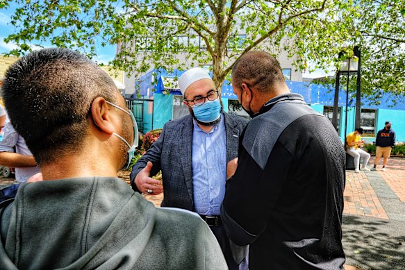 Imam Salih Dogan of the Dandenong Emir Sultan Mosque speaks at the Dandenong vaccination Hub on Sunday. 