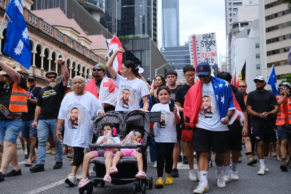 Jeraldine Sa’u, centre, fronts a protest calling for the Queensland government to act on a heat-stress code of conduct outside  state parliament.