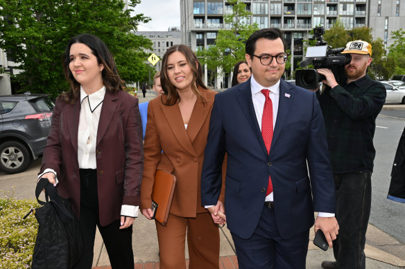 Former Liberal Party staffer Brittany Higgins (centre) and partner David Sharaz arriving at the ACT Supreme Court during the October 2022 trial.