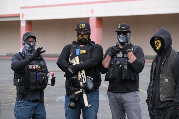 Members of the Proud Boys obscure their identity at a rally on the outskirts of Portland, Oregon, on August 22. 
