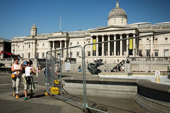 Trafalgar Square’s water fountains were fenced off this week amid 36C temperatures during the fifth heatwave to hit England this European summer. 