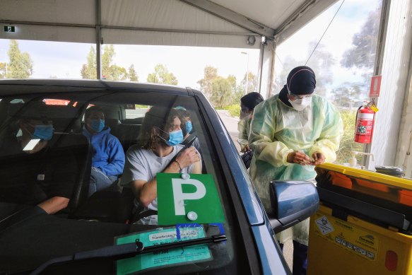 Justin Somerville and Leo Frescos get the Pfizer jab at the Werribee drive-through hub.