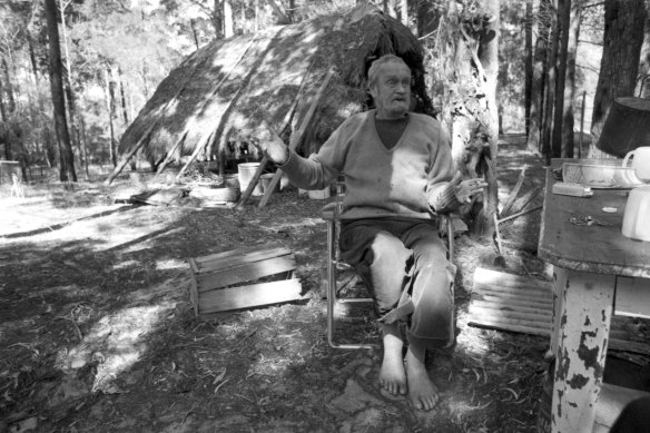 The artist Ian Fairweather relaxes outside his grass hut on Bribie Island, off the coast of Queensland, on September 1, 1970.