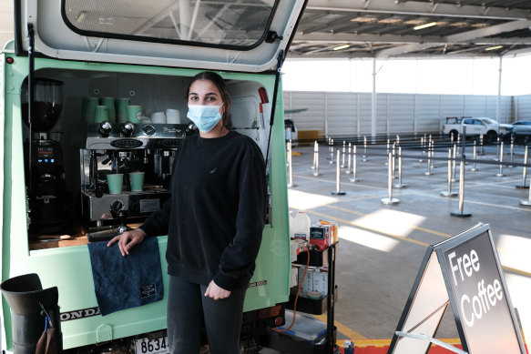 Sonya Paridisis serving coffee in the overflow area at Sydney Airport.