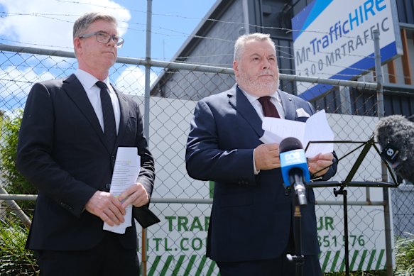Counsel assisting the inquiry Patrick Wheelahan and Commissioner Stuart Wood outside a Gold Coast traffic management firm last week.