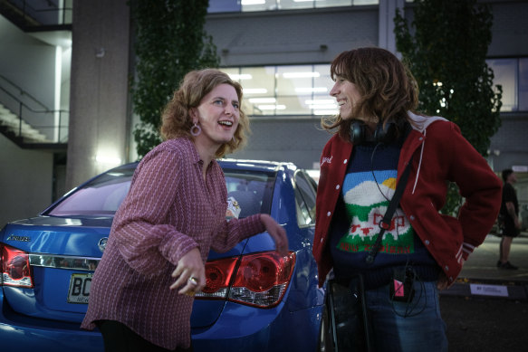 Felicity Ward (left) with director Jackie Van Beek on the set of The Office. 