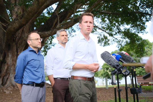 Federal Greens leader Adam Bandt, state MP for Maiwar, Michael Berkman, and federal MP for Griffith, Max Chandler-Mather, at a press conference in New Farm. 