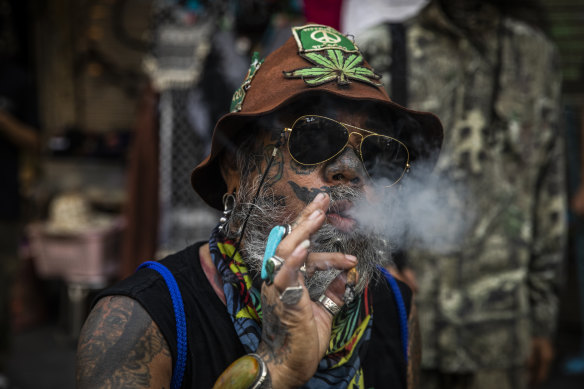 An activist smokes marijuana at a rally to celebrate World Cannabis Day in Bangkok in April.