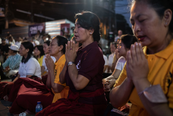 People pray during the commemoration ceremony of the 20th anniversary of the attack in Bali that killed 88 Australians. 