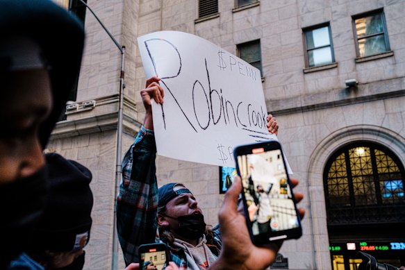 A small protest was held on Thursday in front of the New York Stock Exchange after Robinhood curbed trading in GameStop.