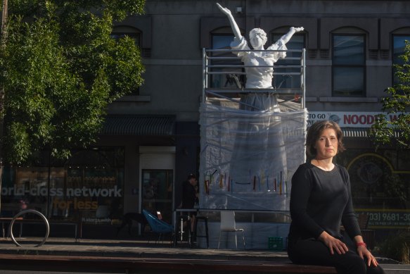 Nina Sanadze in front of her sculpture Call to Peace.