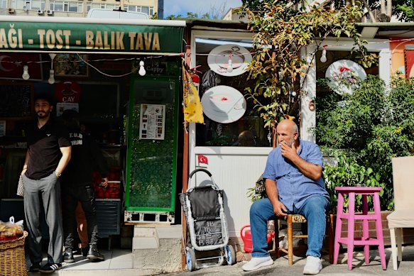 A man sitting outside a flea market in Istanbul, Turkey.