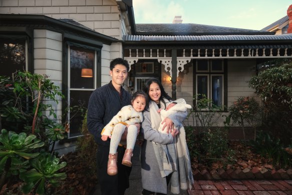 Sean and Jenny Huang and their children in front of their Armadale home which they hope to sell next Saturday.