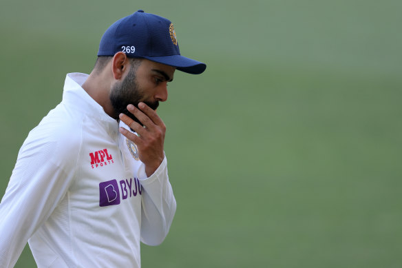 Virat Kohli leaves the field at the end of the Test.