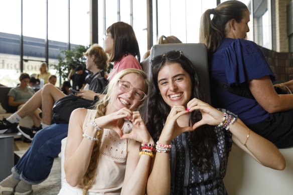 Hannah Brown and Selena Cardillo, both 21, passed the time waiting to buy Taylor Swift tickets by making bracelets of Swift’s song lyrics and titles. 