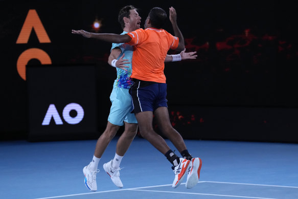 Matthew Ebden and Rohan Bopanna celebrate after defeating Simone Bolelli and Andrea Vavassori in the Australian Open 2024 men’s doubles final.