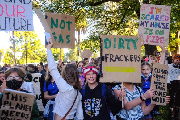 Protesters take part in a climate change rally in Melbourne’s Treasury Gardens on Friday.