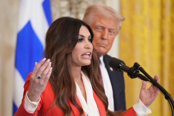 Kimberly Guilfoyle speaks as US President Donald Trump listens at the White House in March 2025.