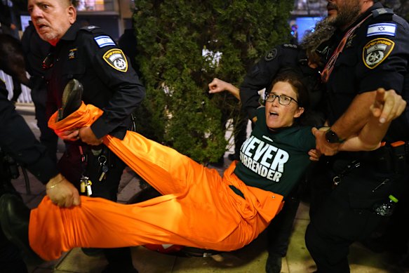 Police disperse demonstrators  in Tel Aviv, Israel, during a protest calling for an end to the war.