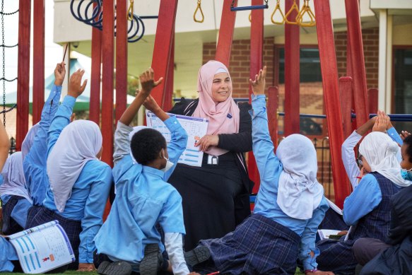 Majida Ali, school curriculum co-ordinator, with students at East Preston Islamic College.