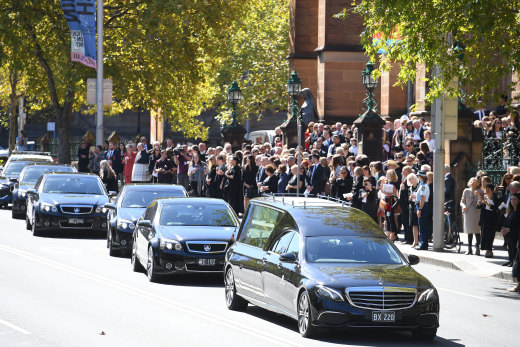 The cortege slowly leaves St Mary’s Cathedral on Thursday down College Street.