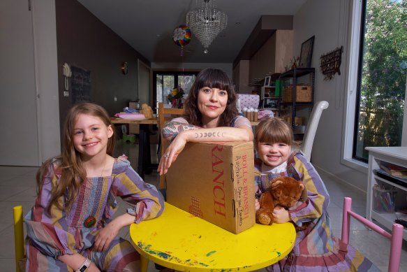 Dawn Rieniets with daughters Lavinia, 8, and Imogen, 4, who are no longer able to get parcels sent from the US.