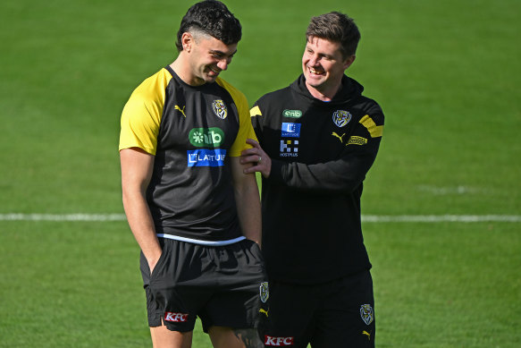 In good hands: Replacement Richmond coach Andrew McQualter chatted with Tim Taranto on Tuesday.
