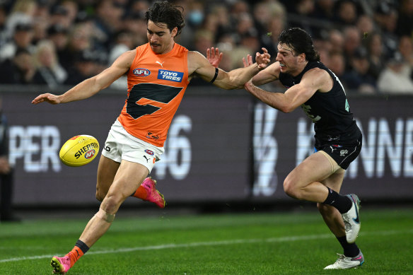 Toby Bedford gets a kick away under pressure against Carlton at Marvel Stadium late last month.