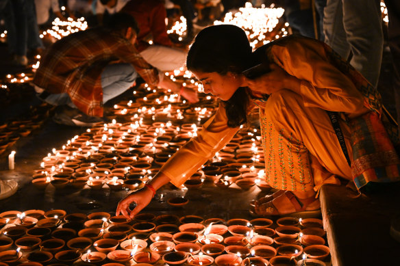 Candles on the banks of the Saryu River during India’s Diwali Festival.