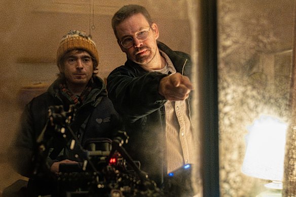 Director and co-writer Zach Cregger, right, on the set of Resident Evil with his leading man, Austin Abrams.