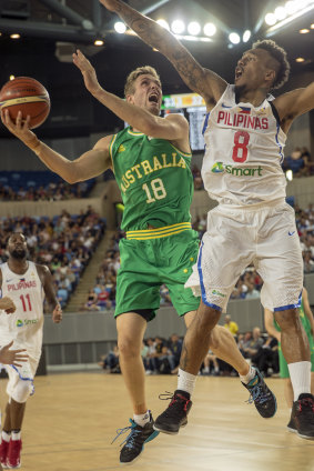 Leap of faith: Australia's Jesse Wagstaff takes the ball to the bucket against Calvin Abueva of the Philippines.