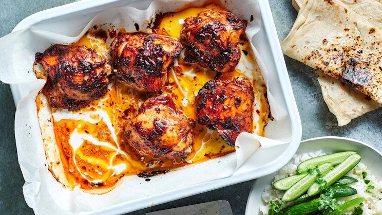 This sticky tamarind chicken tray bake with charred roti comes together effortlessly-image