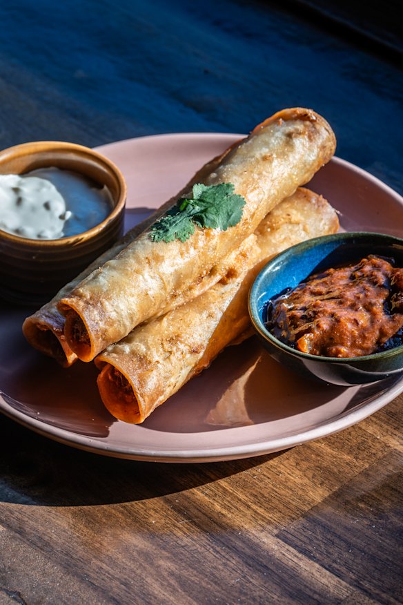 Braised duck taquitos with chipotle salsa. 