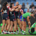 Roosters players celebrate the win.