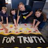 Reservoir East Primary School students with the “Walk for truth” banner.