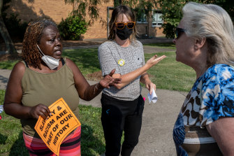 Demonstrators argue during a protest against critical race theory before a school board meeting for the Jefferson County Public Schools district in Louisville, Kentucky, on July 27. 