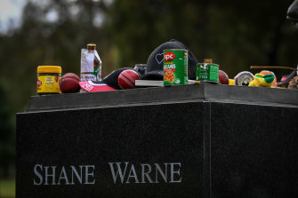 Tributes at Warne’s statue included Vegemite, baked beans and a half-smoked cigarette.