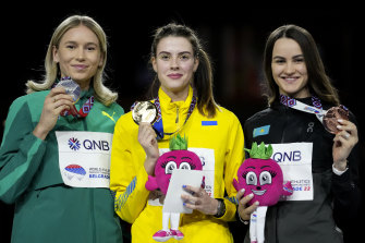 Yaroslava Mahuchikh, centre, on the podium with Eleanor Patterson, left, and bronze medallist Nadezhda Dubovitskaya, of Kazakhstan. 