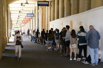 People wait outside the Central Station COVID-19 testing clinic. 