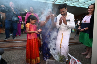 The family taking part in a smoking ceremony by Gangulu Elders at the start of the festival.