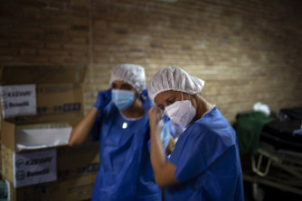 Medical workers prepare to test people for COVID-19 in Barcelona.