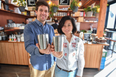 Benjamin Korff and Lily Yap at Kings and Knaves Espresso, a cafe participating in their Viva La Cup deposit scheme that lets you borrow reusable coffee cups. 